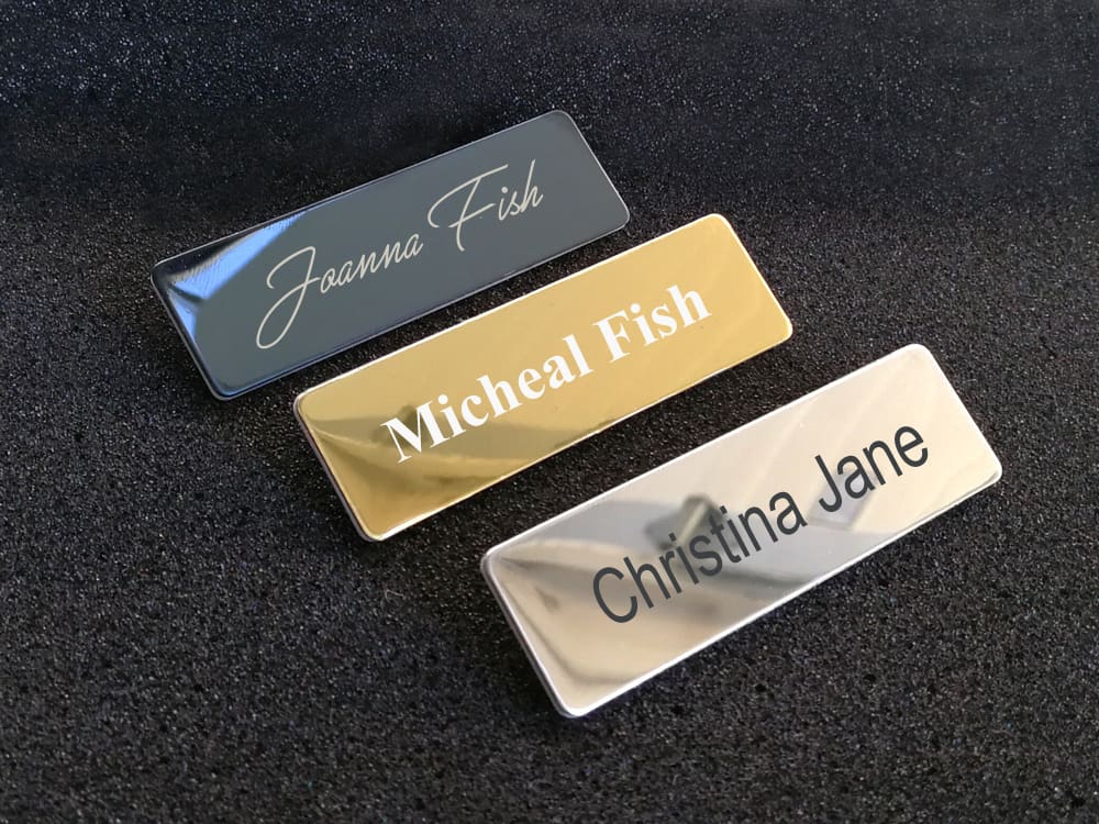 Metal name tags with engraved logo and text